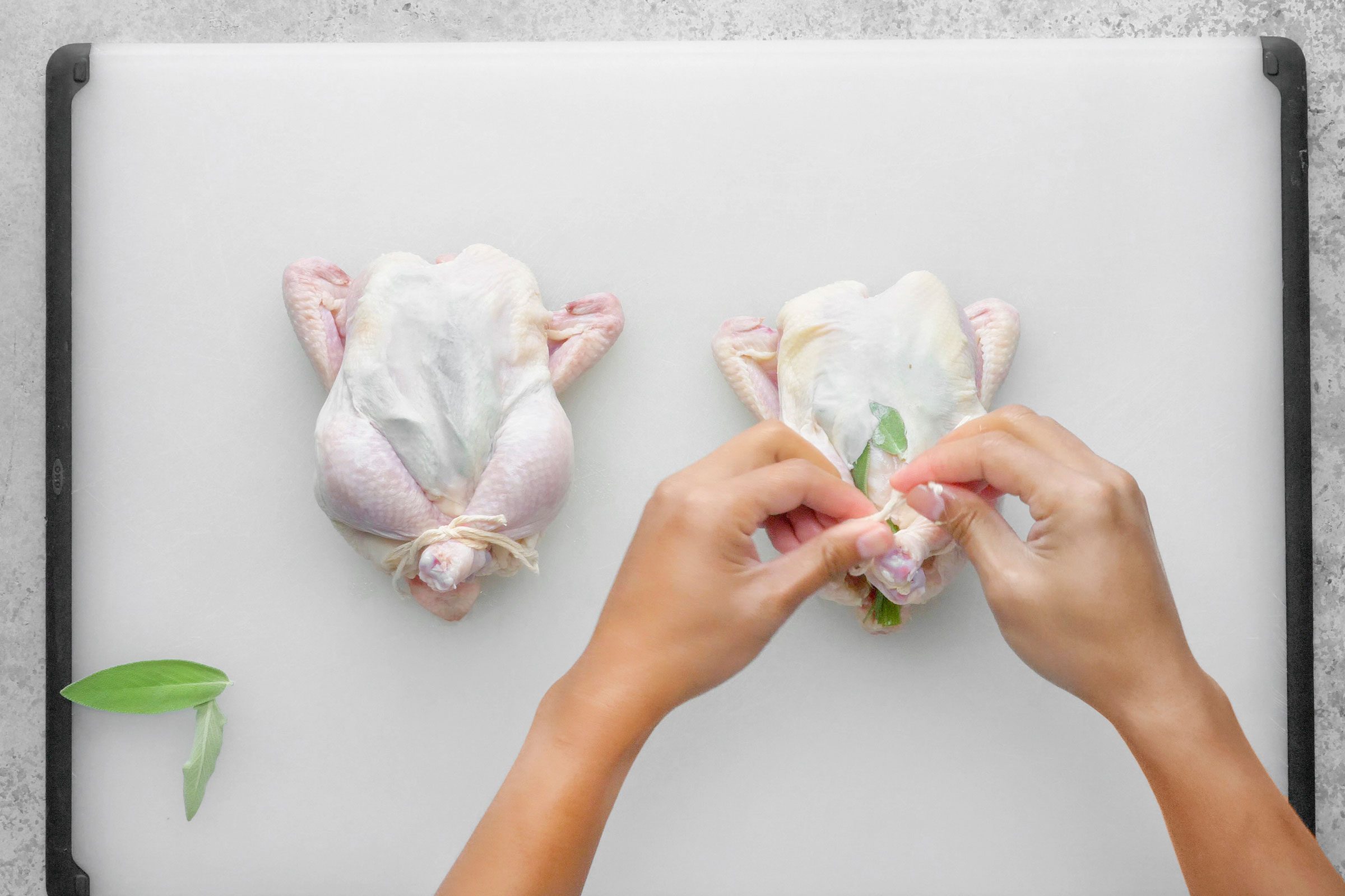 Using butcher’s twine, tied the legs of each hen together with a simple knot