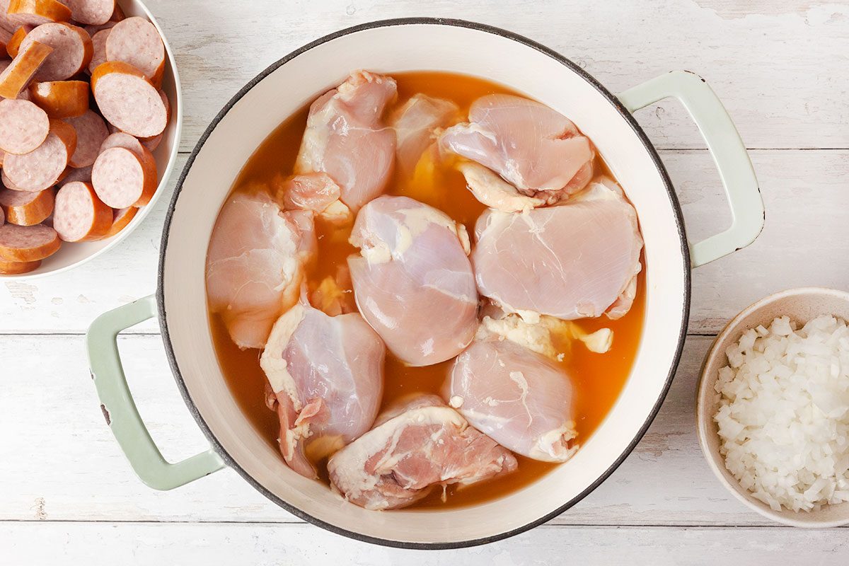 cook the chicken thighs and two cups of the broth in a large pot
