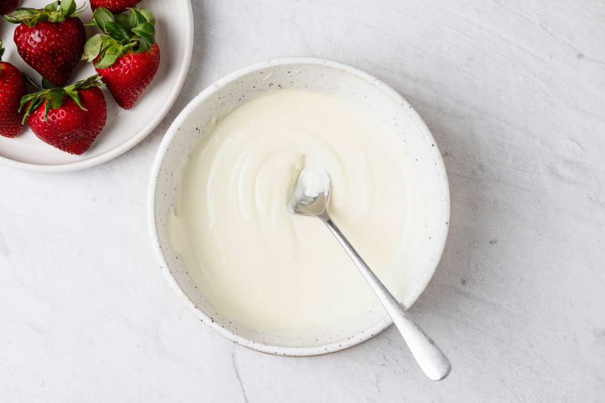 In a microwave-safe bowl, melt white chocolate and shortening
