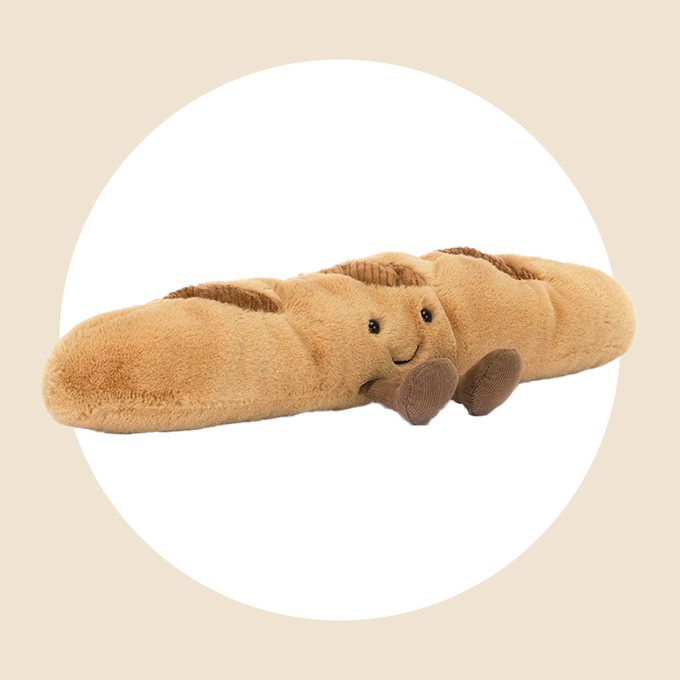 Baguette Jellycat toy product placed in a white circle background