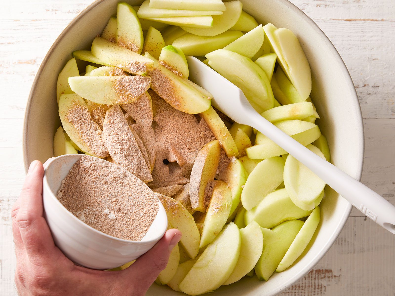 Add dry mixture to apple mixture and toss to coat with white spatula