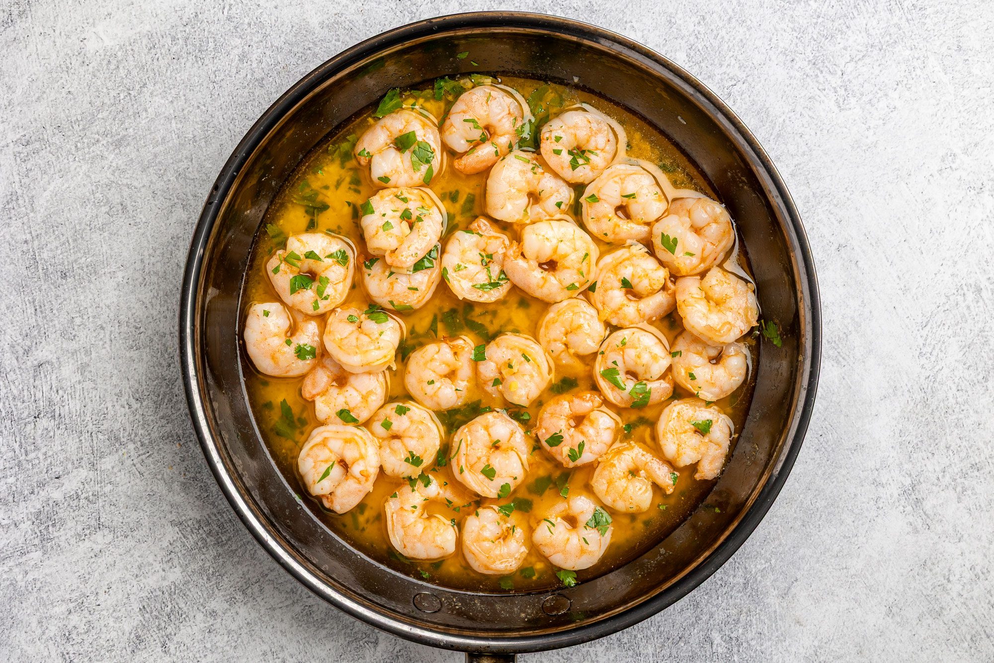 Stir in lime juice and parsley into the skillet