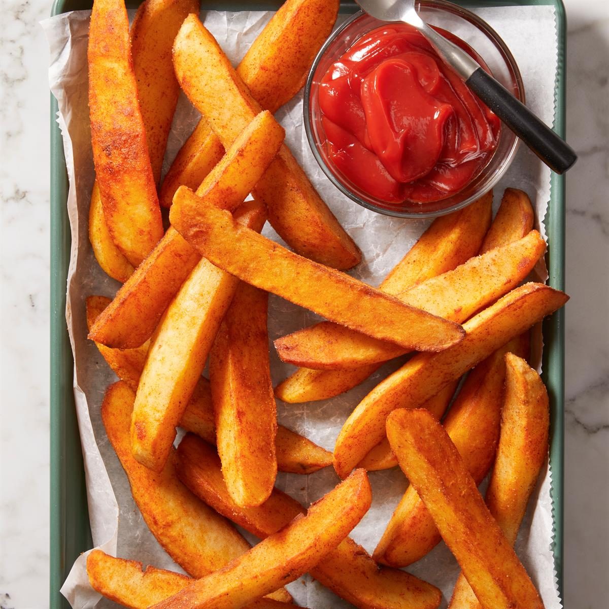 Vertical shot of Jojos served with ketchup