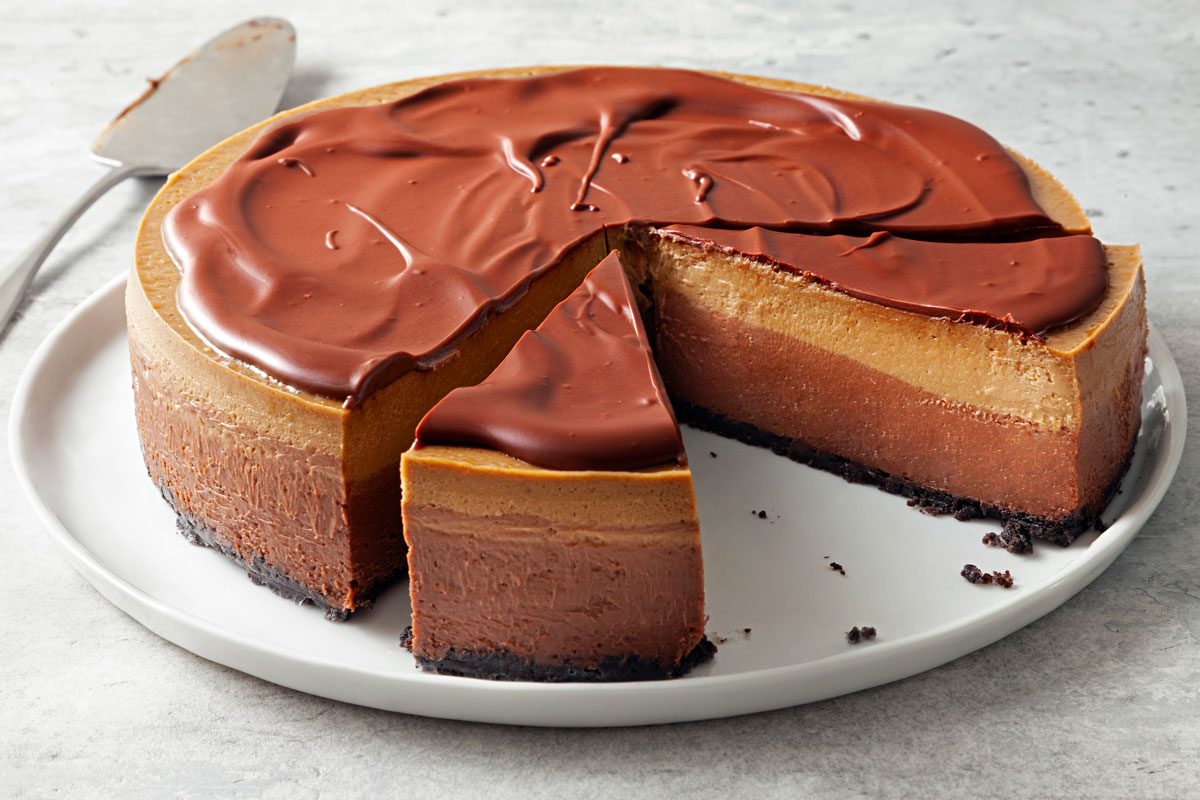 wide shot of layered mocha cheesecake
