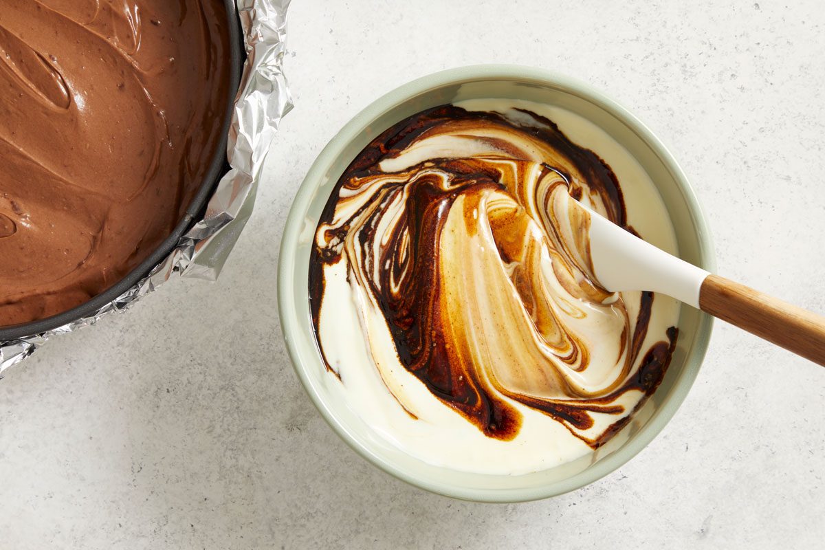 Stir coffee mixture into the remaining batter; spoon over chocolate layer.
