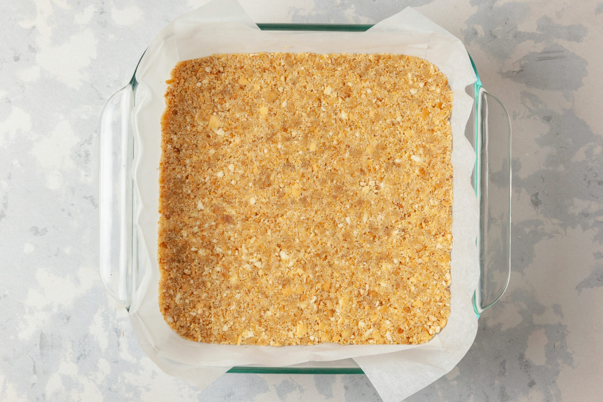 crushed vanilla wafer crumbs with the melted butter pressed on a baking tray