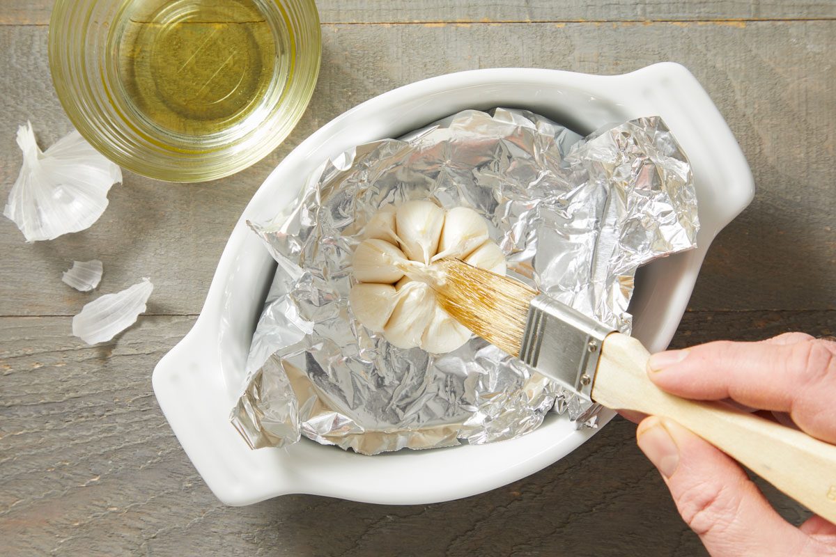 Remove papery outer skin from garlic bulb