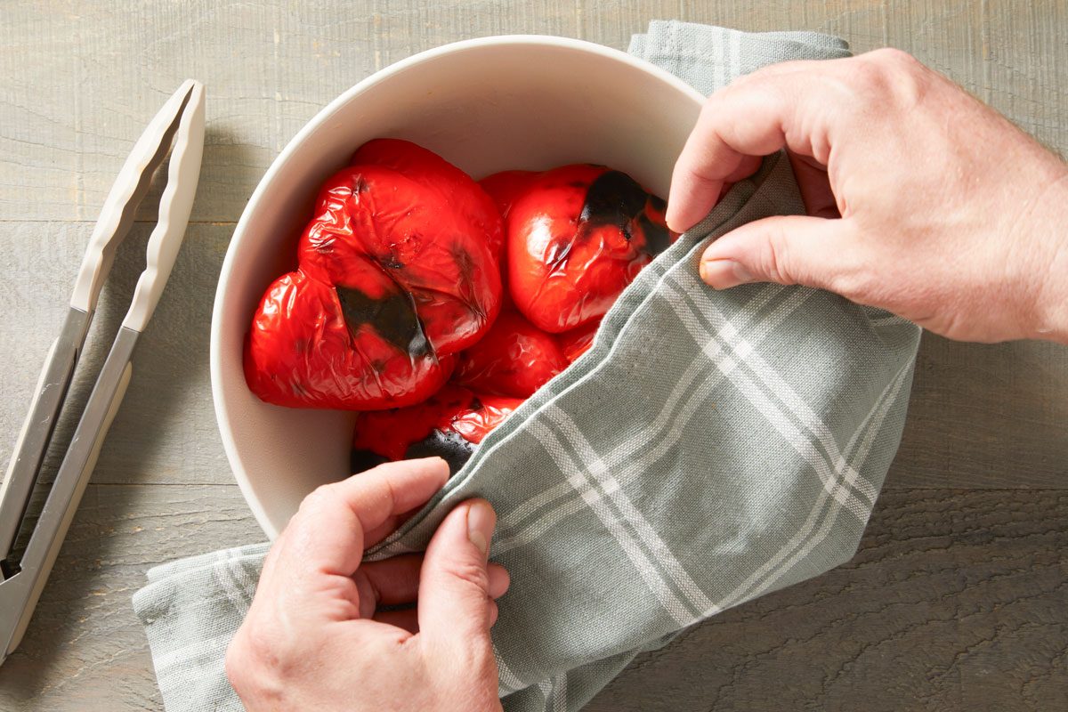 place peppers in a bowl; cover with plastic wrap