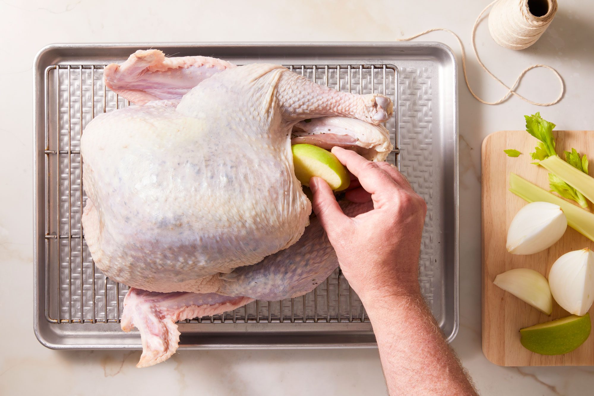 Place apple, onion and celery in turkey cavity;