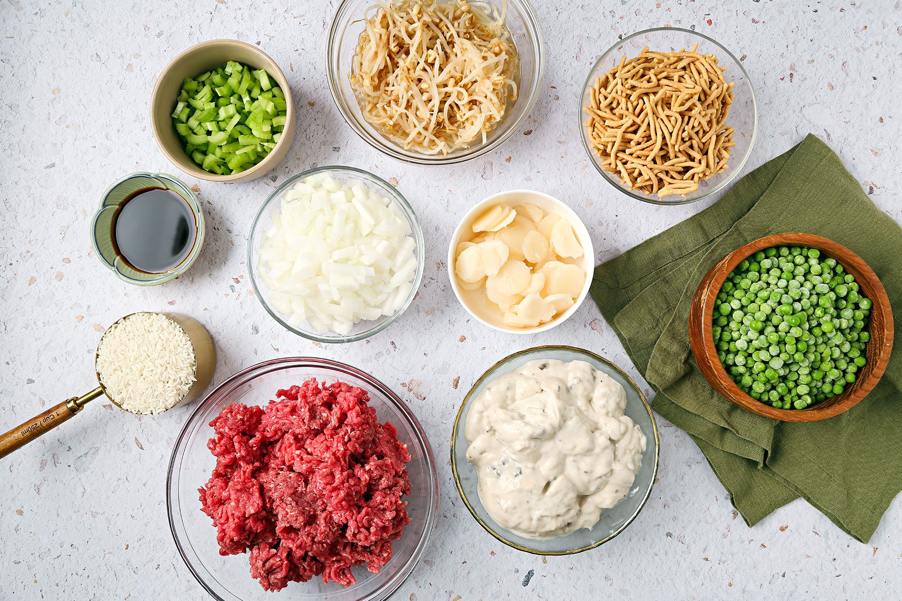 Chinese Casserole Ingredients in big and small bowls on a counter.