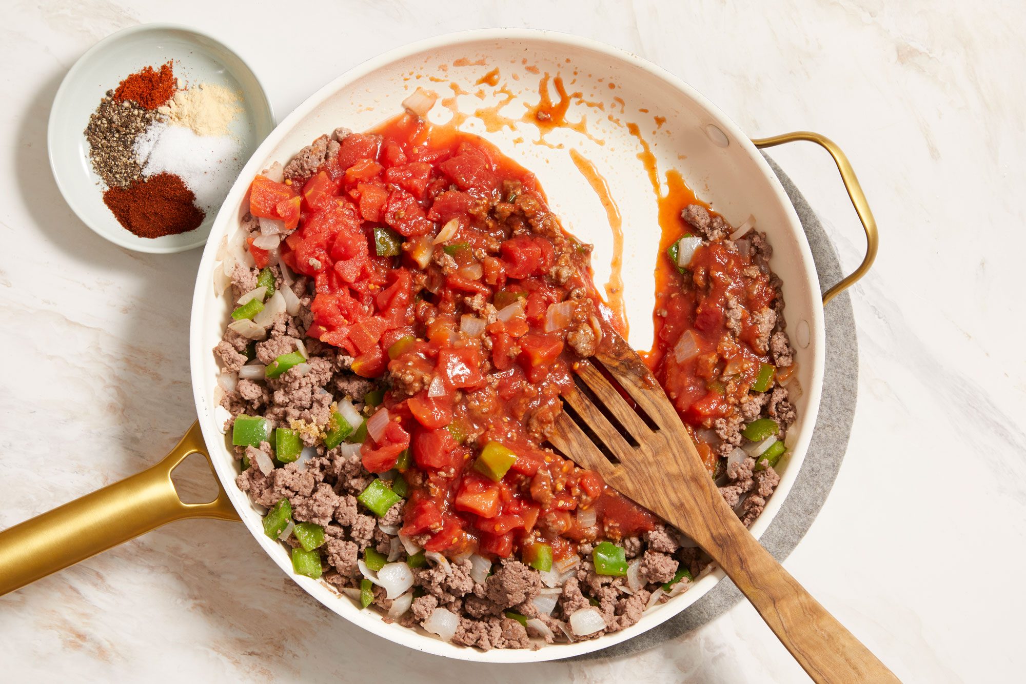 Stir in tomato sauce and other spices