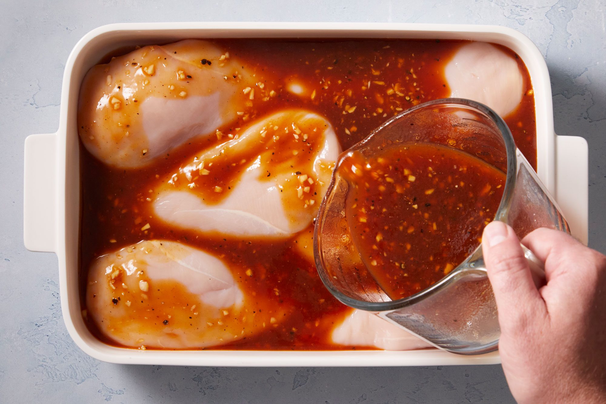 Place chicken in a shallow dish. Add half the marinade; turn to coat.