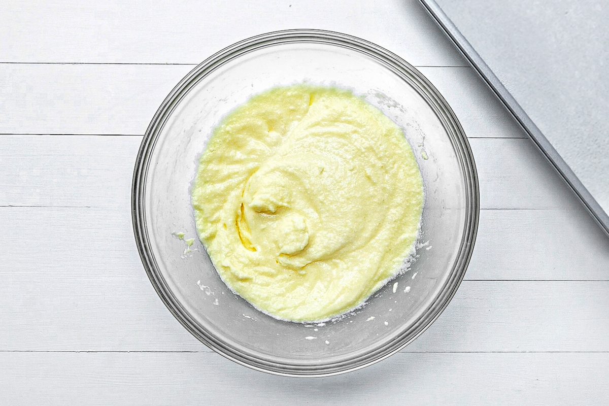 butter, sugar and eggs beat together in a bowl