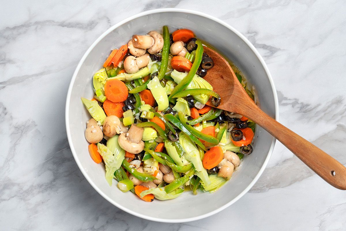 Pimientos and parsley being mixe in the vegetable 