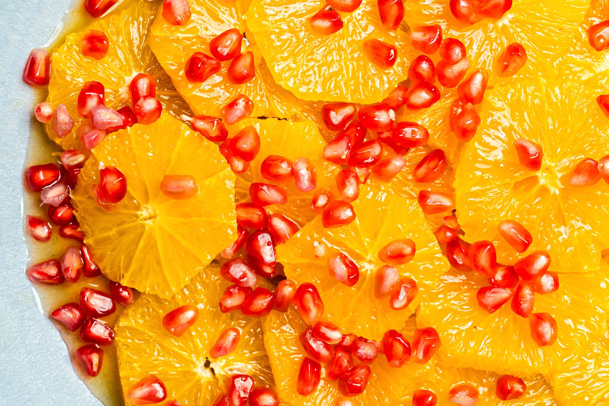 Close up shot of Orange Pomegranate Salad with Honey