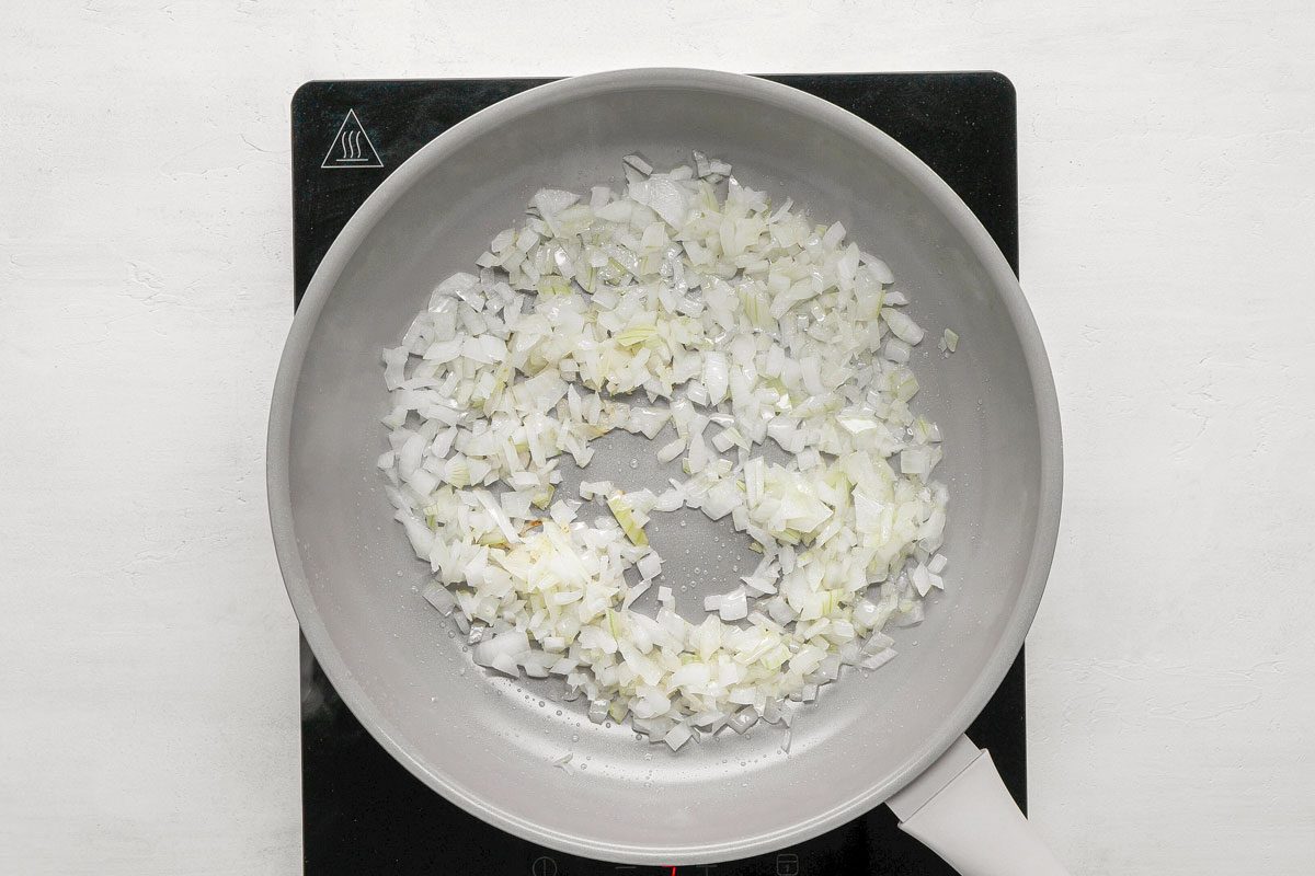 In a small skillet, saute onion in oil until tender. Add oregano and garlic;