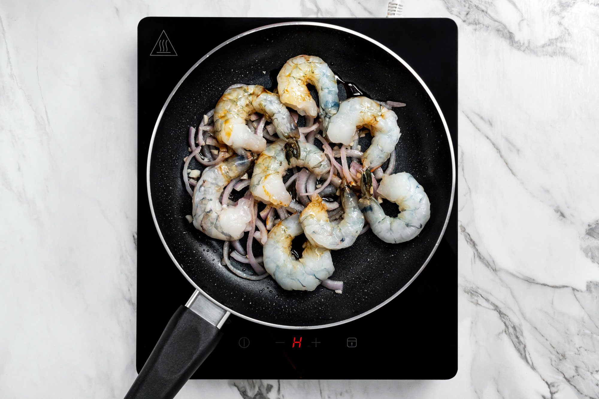 Add the shrimp, water and soy sauce