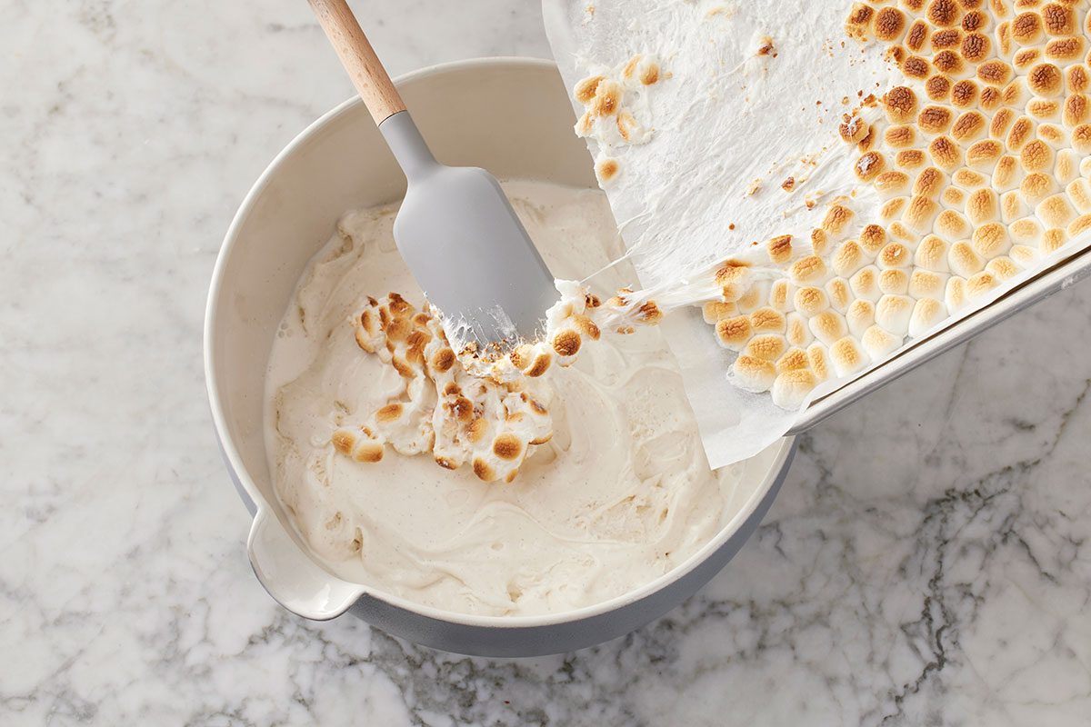 Toaseted marshmallows being added in to the ice cream mixture