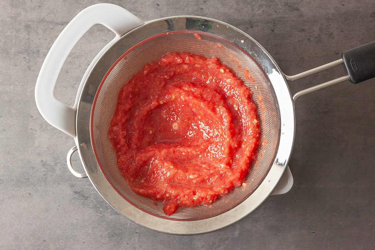 Pour the puree into a fine mesh strainer set over a bowl