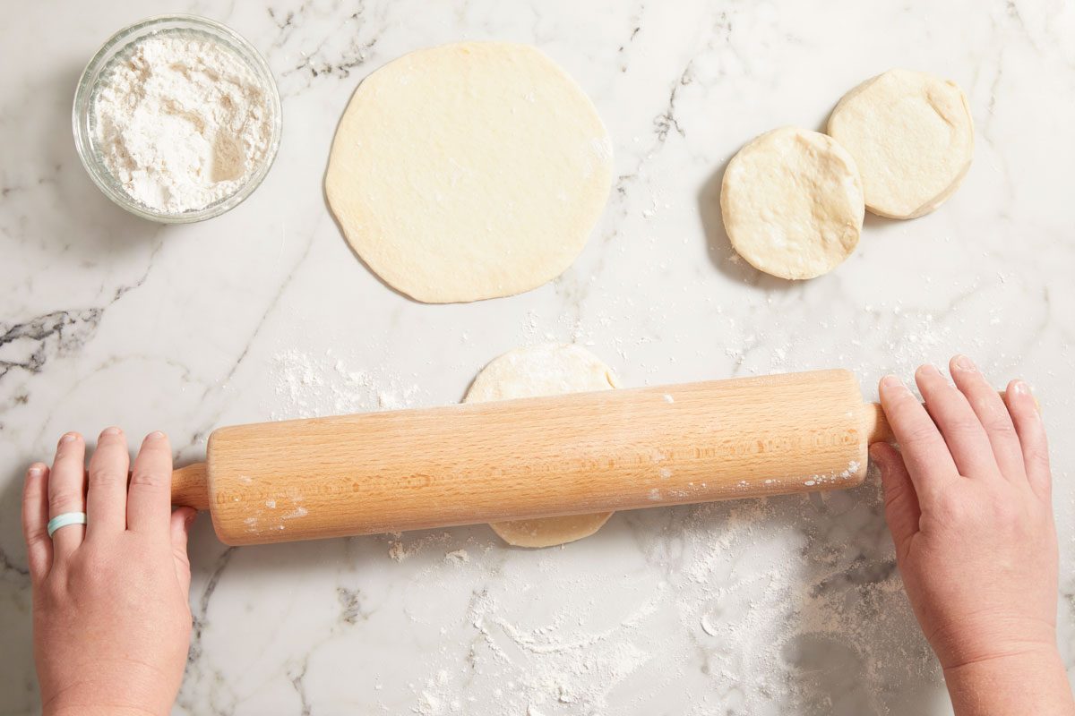 On a lightly floured surface, pat or roll each biscuit into a 6-in. circle.