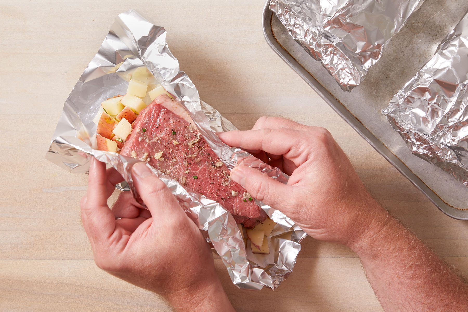 Folding the Steak And Potato Foil Pack.