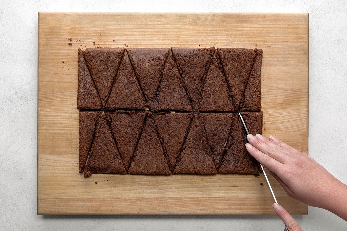 Cutting Christmas Tree Brownies in the shape of a tree
