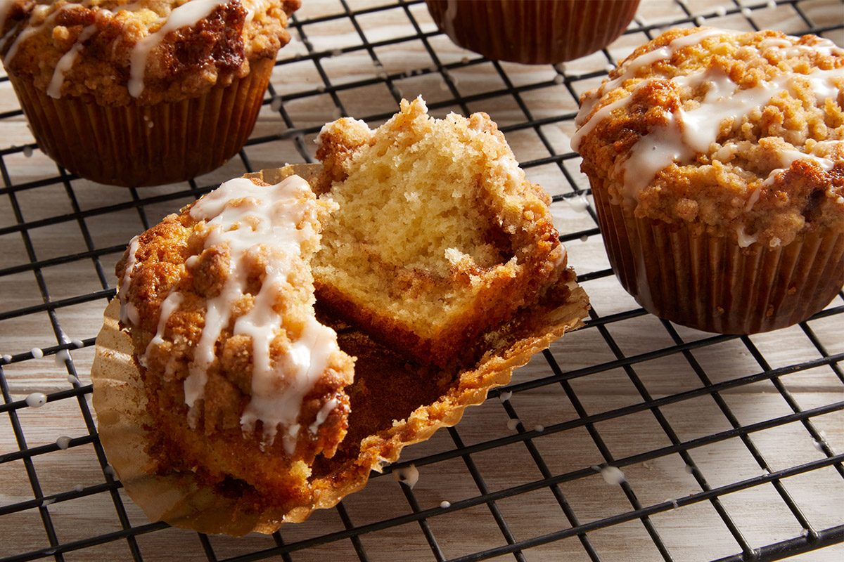 Close up shot of Glazed Coffee Cake Muffins on a wired rack