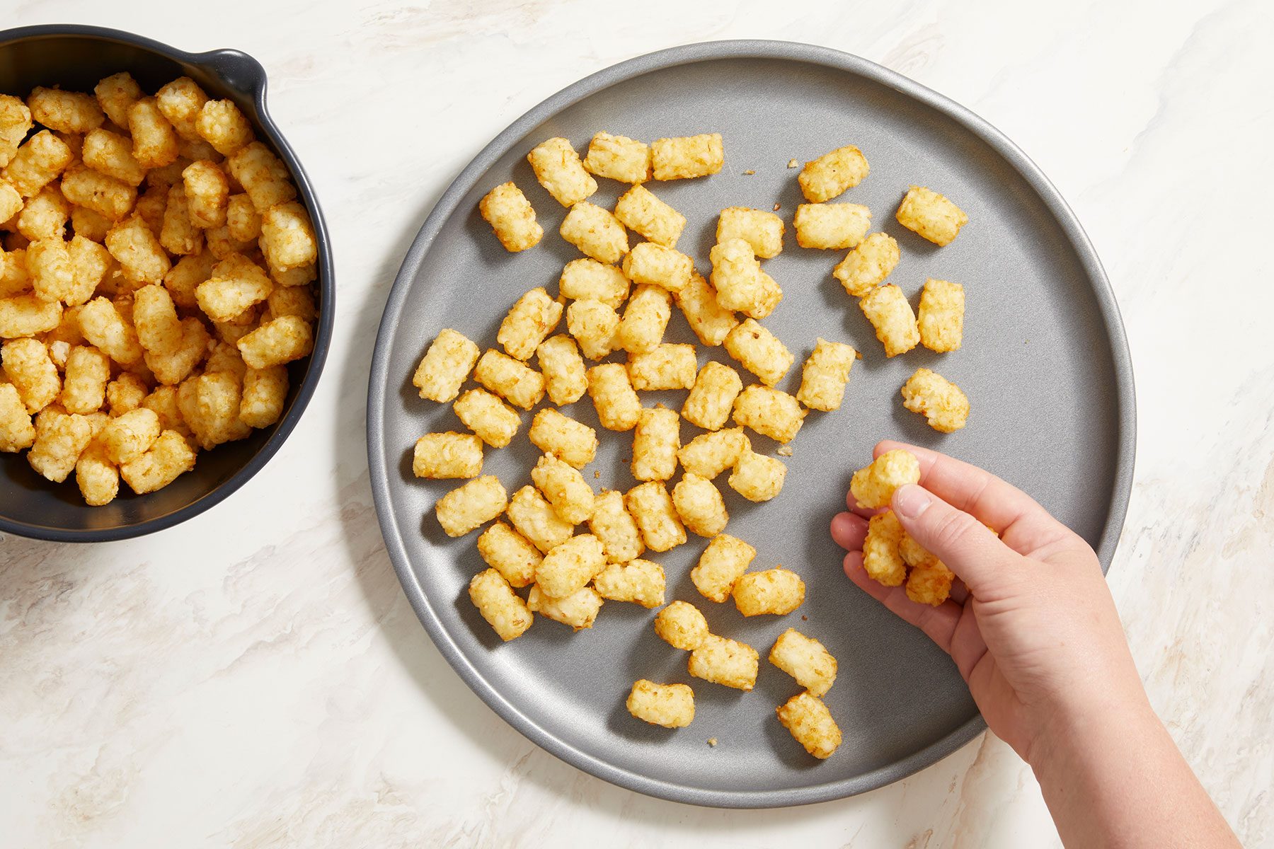 On a 12-inch pizza pan, baking the Tater Tots.