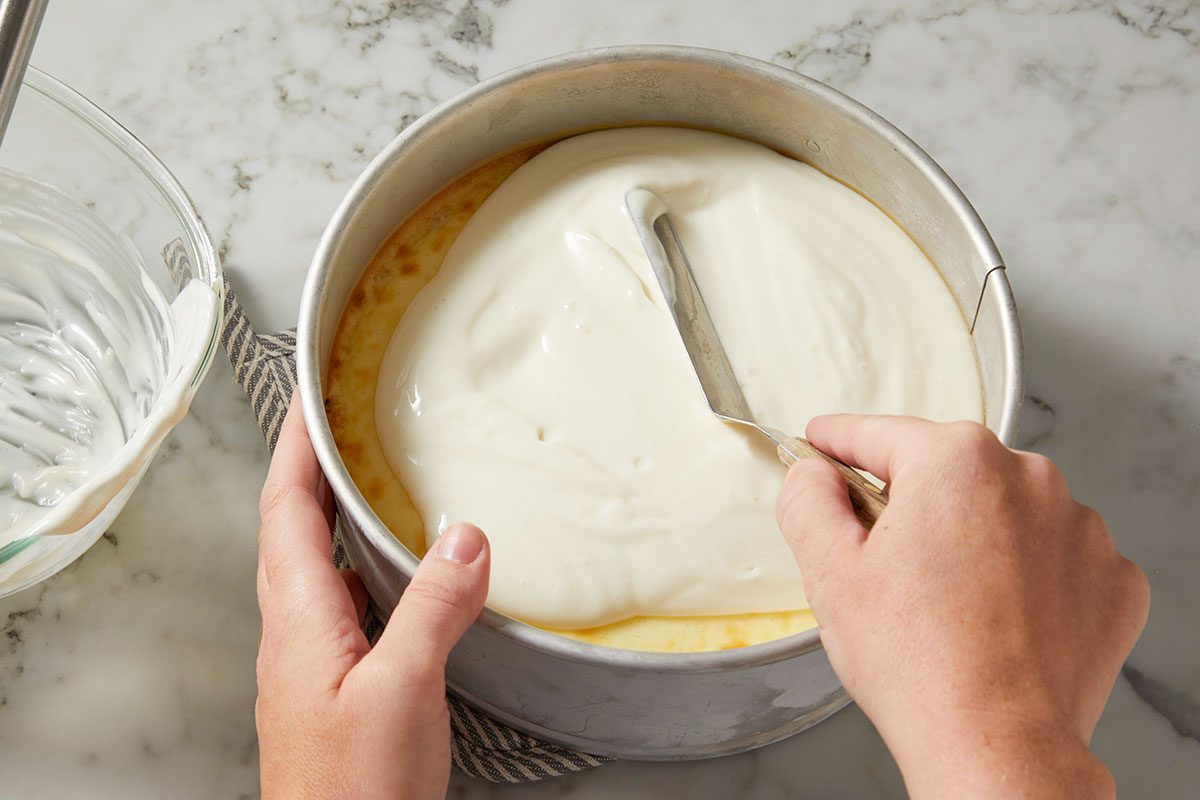 spread cream mixture over cheesecake.