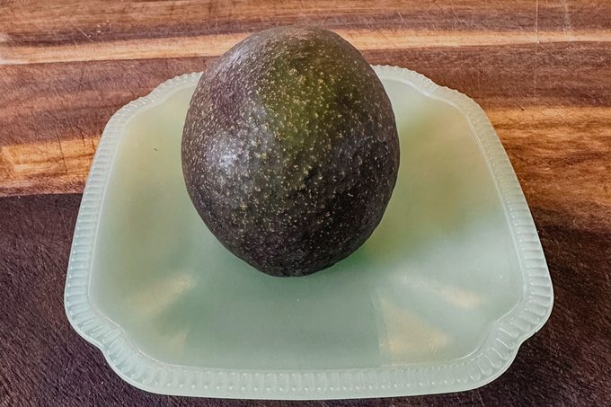 sliced avocado upside down on a plate