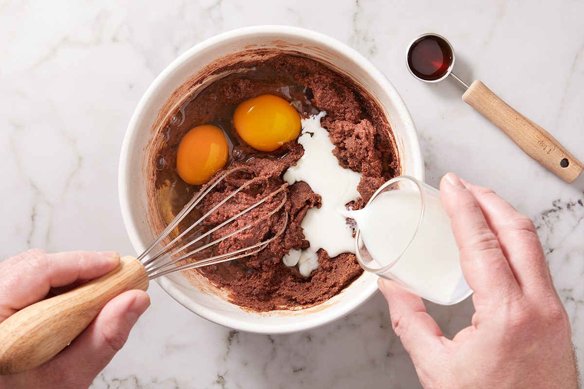 Wishing eggs and vanilla extract with a brownie batter